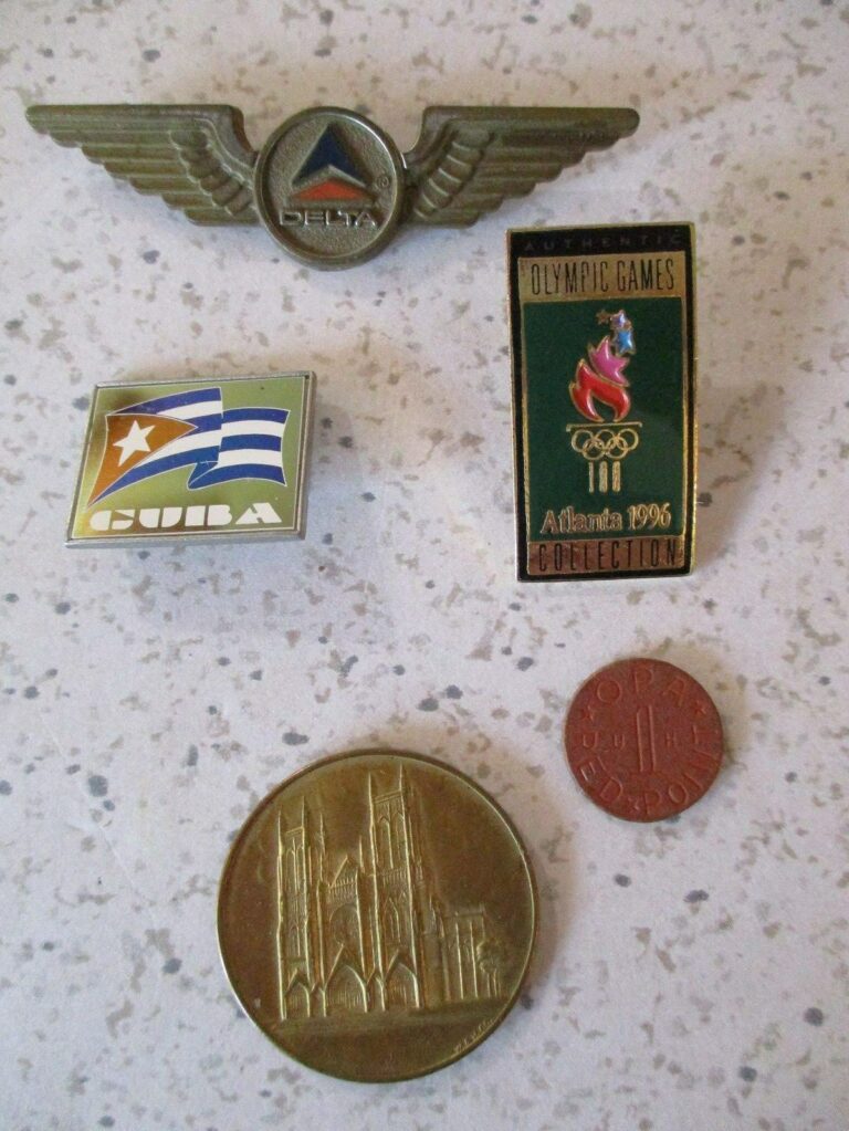 Read more about the article 5 PINBACKS-COINS  DELTA  CUBA 1996 OLYMPICS  ST. JOHN THE DEVINE  WWII OPA TOKEN