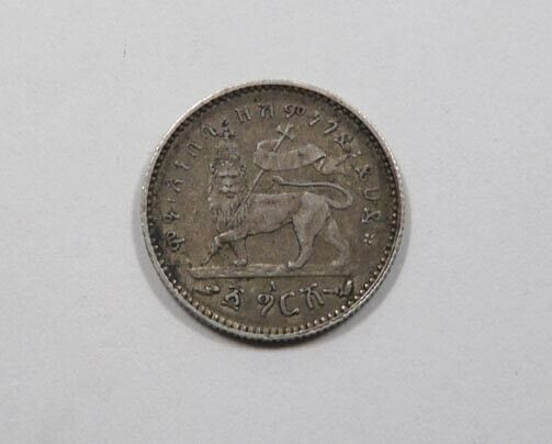 Read more about the article Ethiopia Menelik II Silver 1/20 Birr Gersh 1897 Lion Holding Flag EE 1889 A NICE