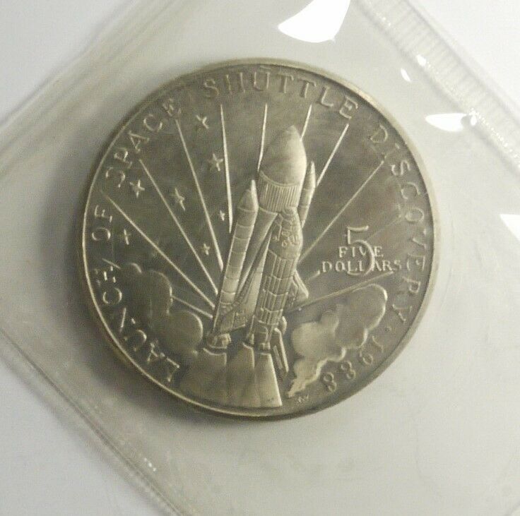 Read more about the article 1988 Marshall Islands Space Shuttle Discovery $5 Dollar UNC Coin and Pamphlet