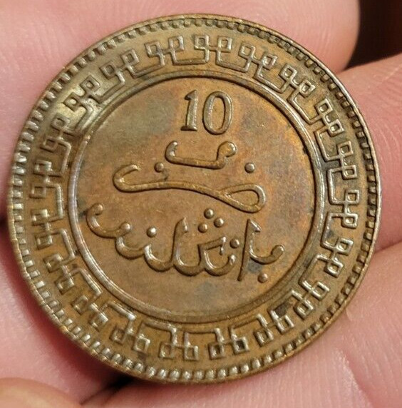 Read more about the article 1320 (1903) Morocco 10 Mazunas High Grade coin  proof-like luster in fields