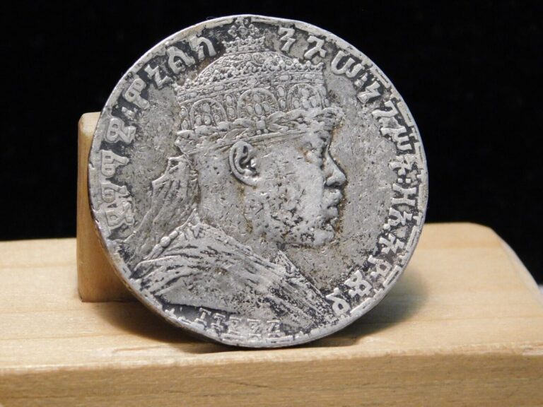 Read more about the article Ethiopia 1-Birr Menelik II silver crown size coin