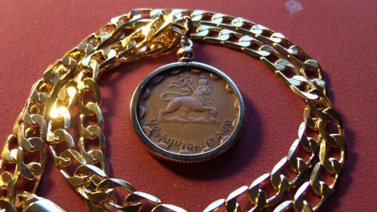 Read more about the article Haile Sellasie “Lion of Judah” Coin Pendant w/24″ 18k Gold Filled Mariner Chain