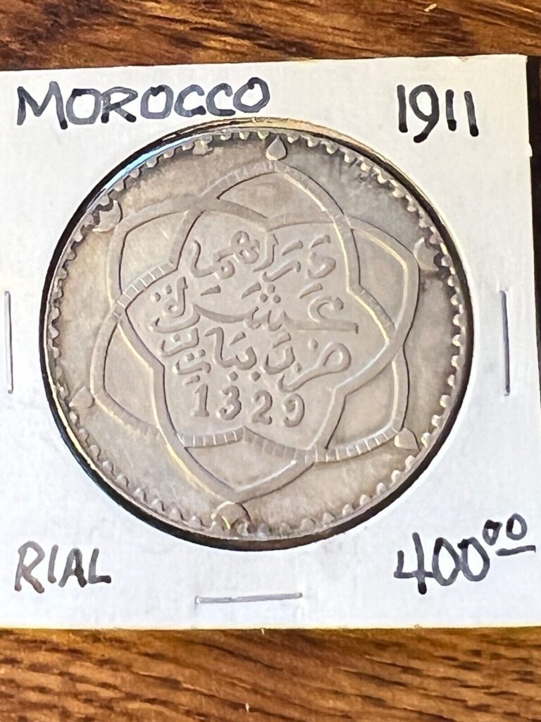 Read more about the article MOROCCO 1911 RIAL..CHOICE TONED UNC..