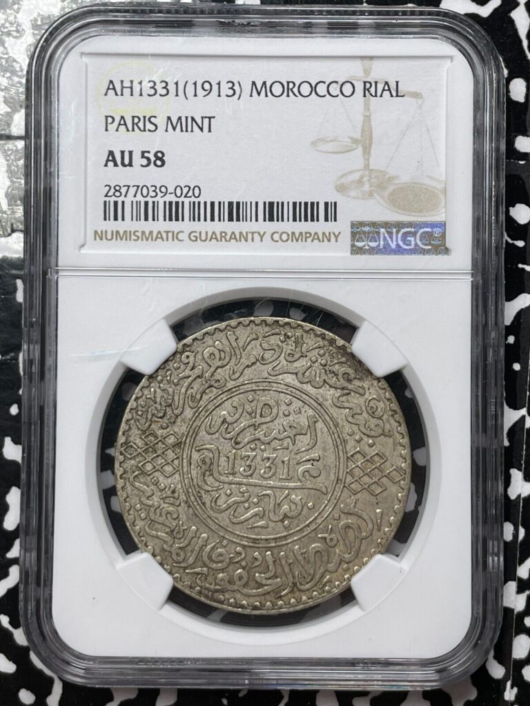 Read more about the article AH 1331 (1913) Morocco 1 Rial NGC AU58 Lot#G4192 Large Silver Coin!