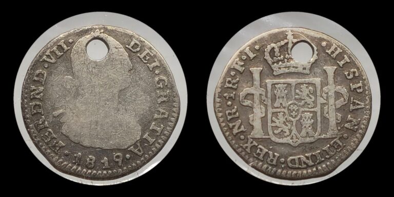 Read more about the article 1819 Colombia 1 Real  .896 Silver  Bust of Carlos IV   NR FJ  Inverted J  Holed