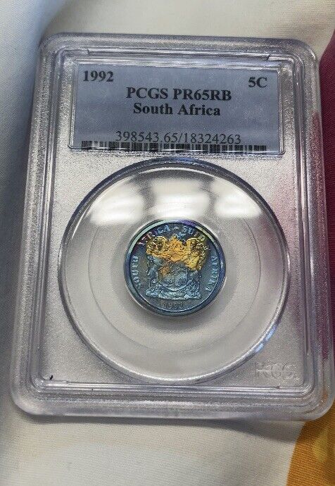 Read more about the article 1992 5C South Africa Proof 5 Cent  PCGS PR 65 RB Neon Rainbow Toned