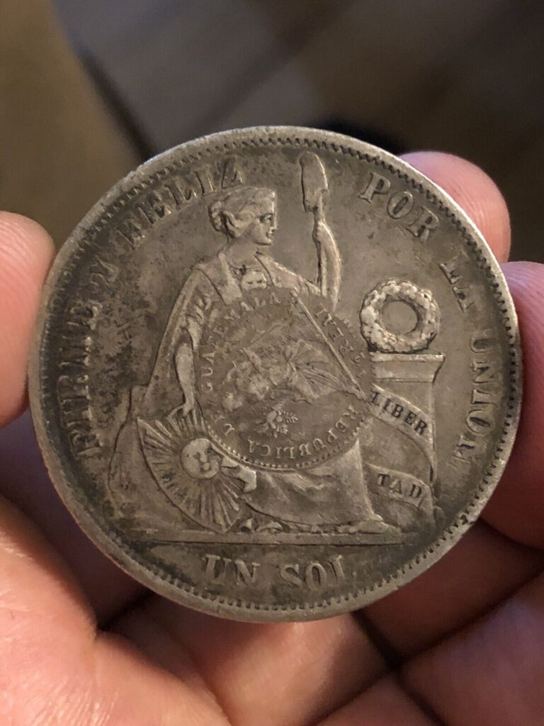 Read more about the article 1894 Guatemala Silver 1/2 Real C/S Counter-Stamped  on 1866 Peru UN SOL Coin