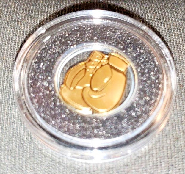 Read more about the article Republic Of Palau 1/2 gram Gold $1 Boxing Gloves Shaped Coin Black Ring Airtite