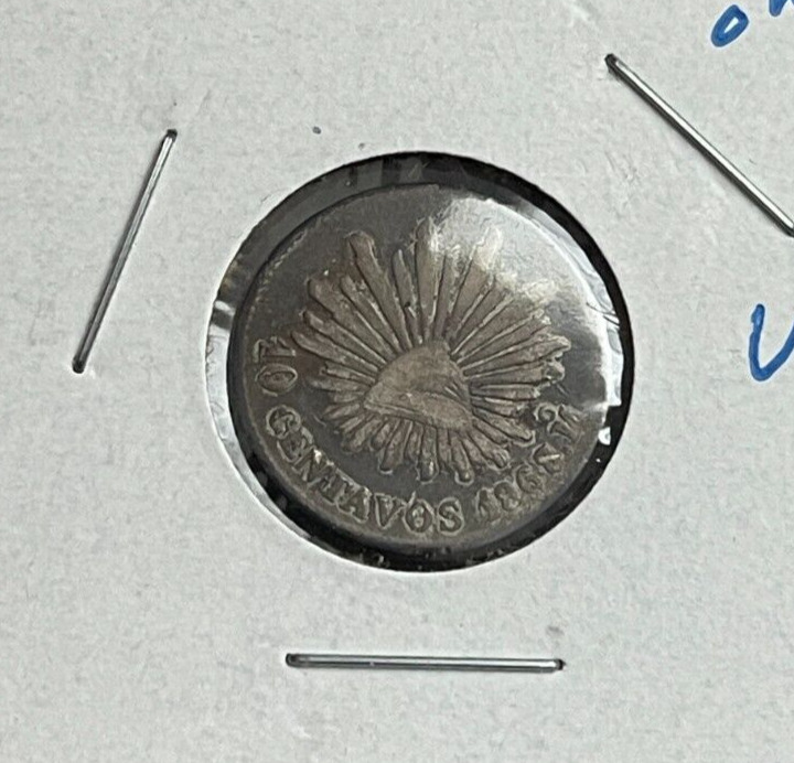 Read more about the article 1868 Mo Mexico 10 Centavos – 8/7 Overdate – Silver L2