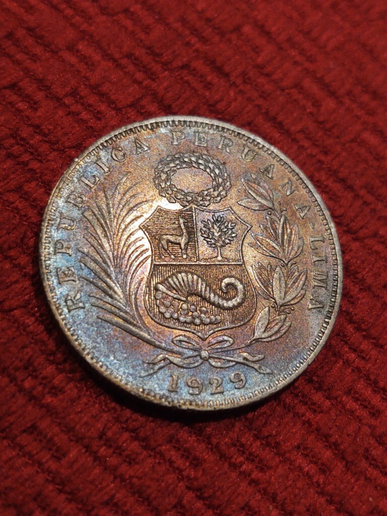 Read more about the article 1929 UNC Silver 1/2 Sol Peru Naturally Blue and Crimson Toned Overdate Variety