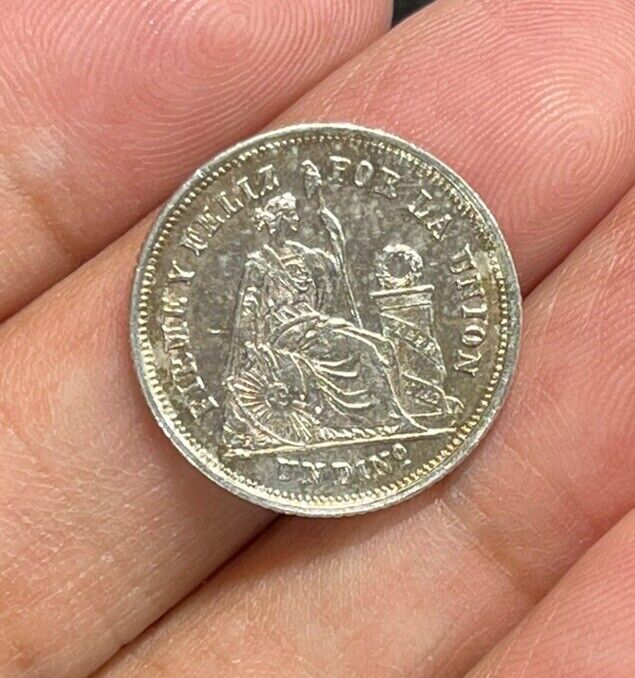 Read more about the article 1864 Peru One Dinero Silver Coin High Grade