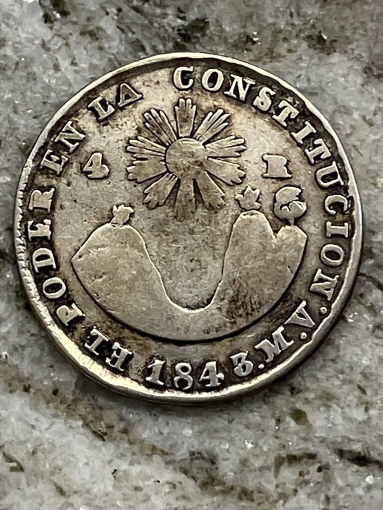 Read more about the article 1843 MV Ecuador 4 Reales Quito Sun Volcanos Silver Coin VG-F