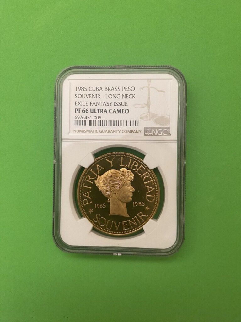 Read more about the article L@@K CARIBBEAN COIN SOUVENIR  PESO 1985 EXILE  RARE  NGC “LONG NECK” BRASS