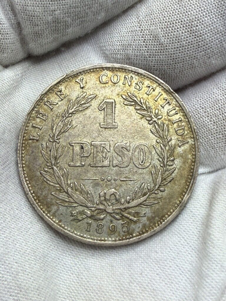 Read more about the article 1895 URUGUAY  1 PESO. SILVER COIN Toned J86