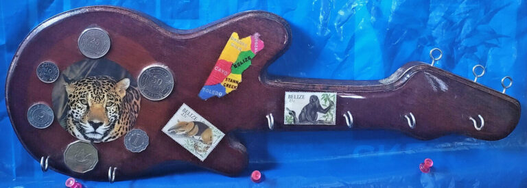 Read more about the article Belize Guitar Shape Wooden Key Rack With Genuine Coins And Stamps Handmade RARE