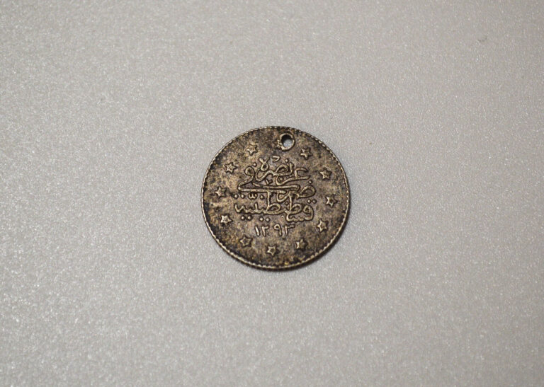 Read more about the article KURUSH PIASTRE Ottoman Empire Silver Coin Turkey 1293/1876/27 HOLED