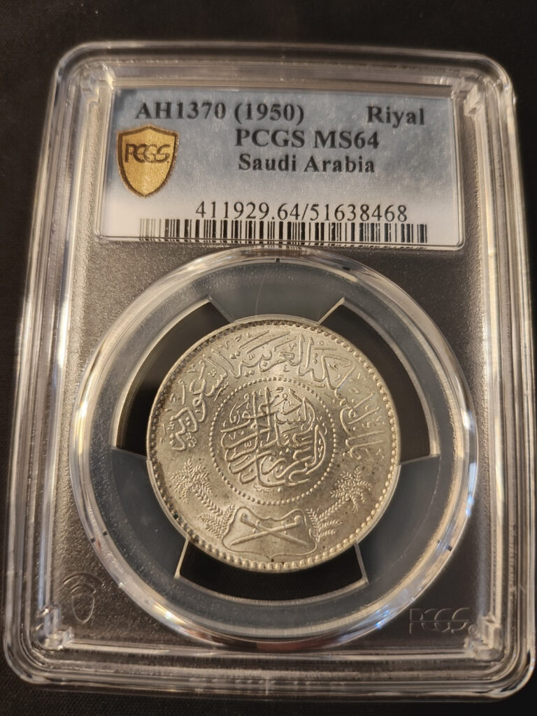 Read more about the article 1950 (AH 1370) Saudi Arabia 0.9+ Silver 1 Riyal – PCGS: MS 64