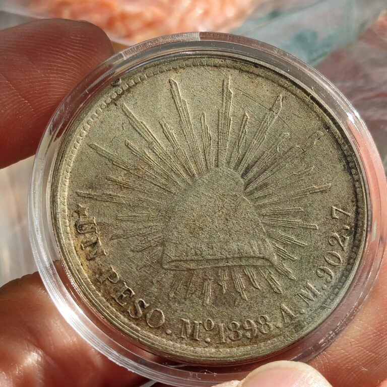 Read more about the article 1898 Mo AM Mexico Cap and Rays Silver Peso China Restrike of 1949 Un Peso Coin