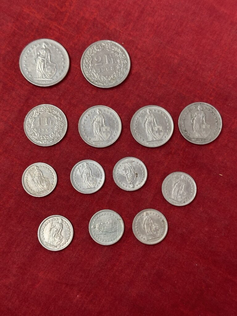 Read more about the article LOT OF 13 SWISS FRANCS COINS 1968 1969 1970 1974 Circulated Ungraded Switzerland