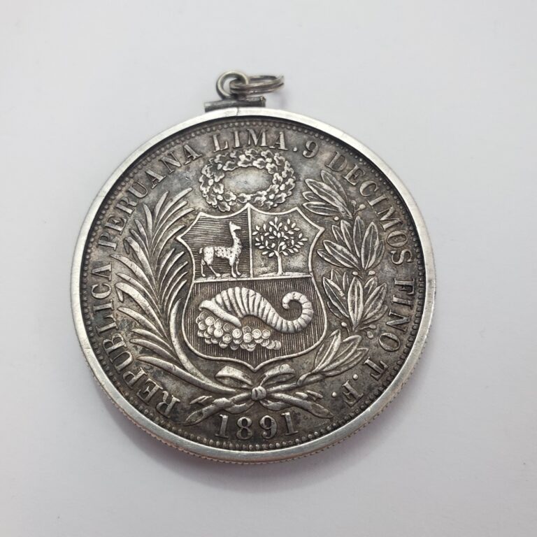 Read more about the article Uncleaned 1889 TF Peru 1 Sol coin  with Sterling Silver pendant frame and bail