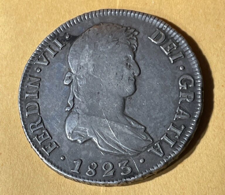 Read more about the article ATTRACTIVE 1823 8 Reales Spanish Colonial Silver Old Coin Potosi Mint Pirate Era