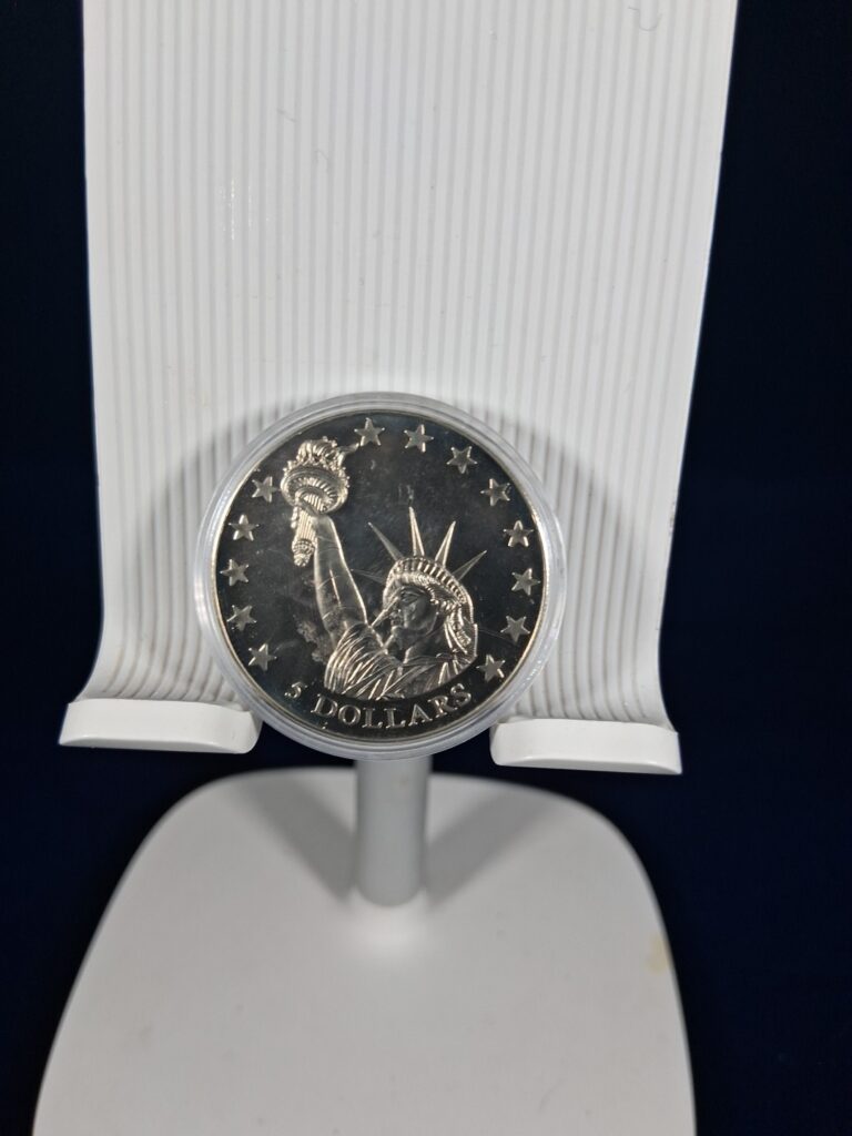 Read more about the article World Coins And Currency- 2000 American Mint History Of America 5$ Liberia