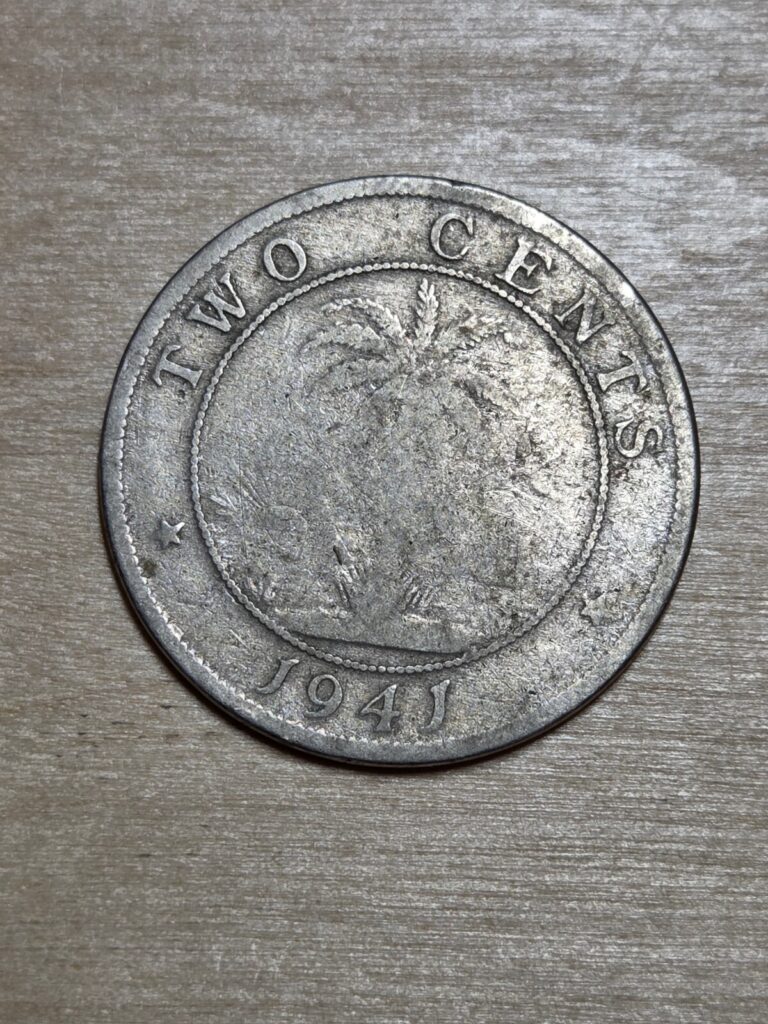 Read more about the article Liberia 2 cents coin  1941. KM# 12a  copper-nickel. Elephant and star. Palm tree