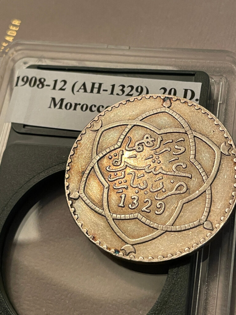 Read more about the article AH 1329 ( 1911 ) Morocco 10 Dirhams Rial Large World Silver Coin w/ Plastic Case