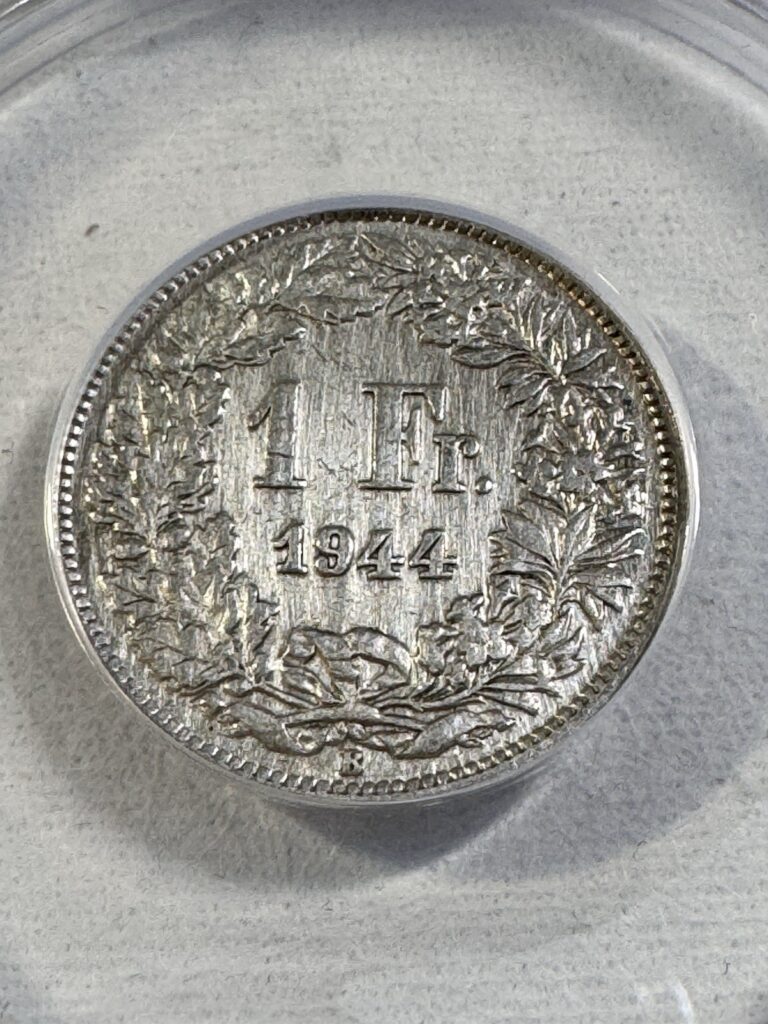 Read more about the article 1944-B Switzerland 1 Franc Silver Coin Graded AU 50 Details Cleaned by ANACS