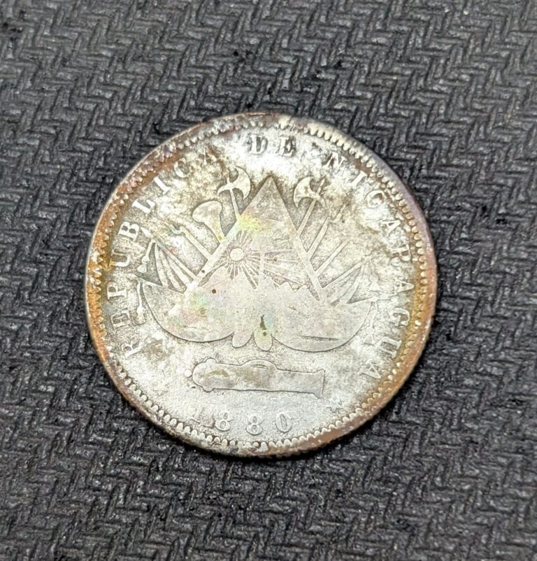 Read more about the article 1880 H Nicaragua Silver 20 Centavos Orange Toning KM#4