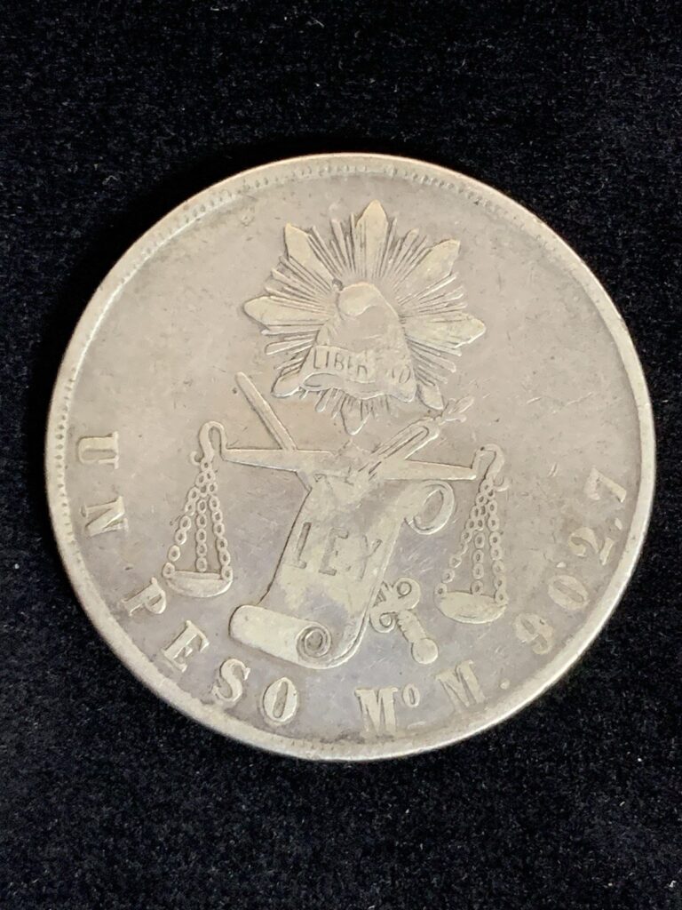 Read more about the article Mexico 1 Un Peso 1873 Mo  Cap and Scale Silver Coin VF – XF Balance Scale