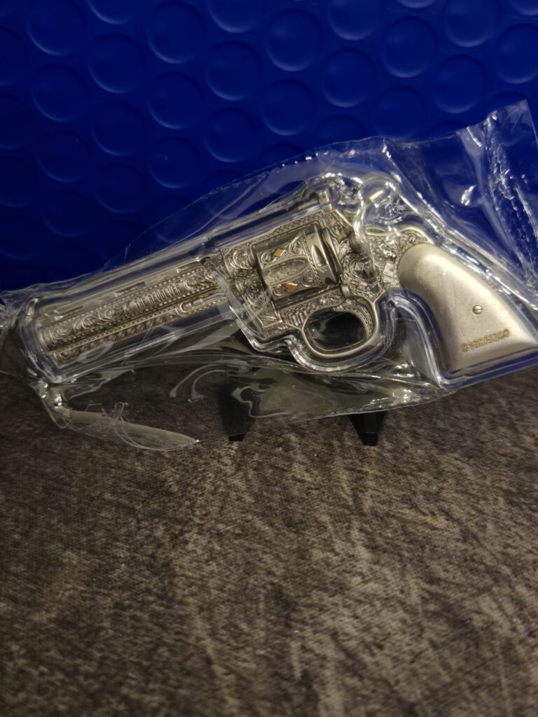 Read more about the article 2023 Chad 2 oz Silver Revolver Gun Shaped Antiqued High Relief Coin .999 (w/Box)