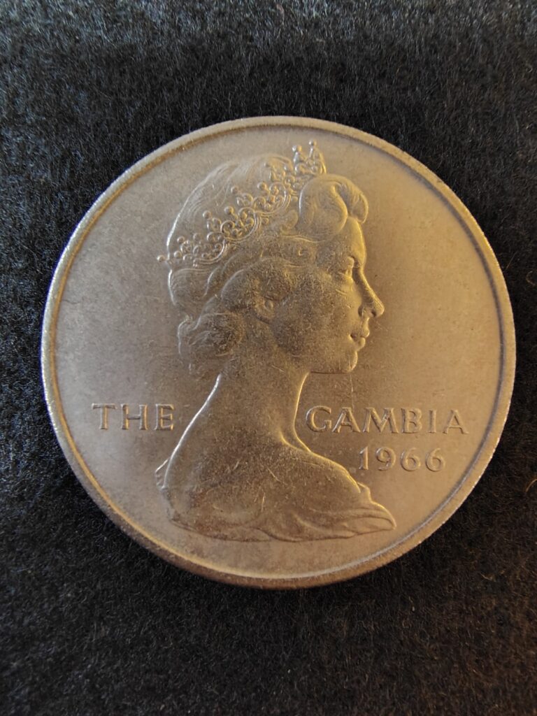 Read more about the article 1966 The Gambia – 4 Shilling Coin -Queen Elizabeth / Slender-Snouted Croc