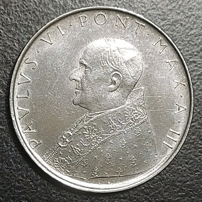 Read more about the article 1965-III VATICAN CITY 100 LIRE STAINLESS STEEL VINTAGE COIN POPE PAUL VI KM 82.2