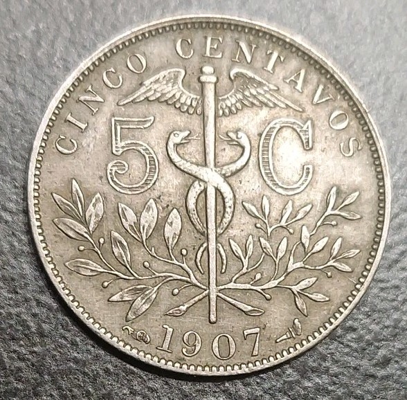 Read more about the article 1907 BOLIVIA 5 CENTAVOS KM 173.3 Beautiful Better Grade Coin Caduceus