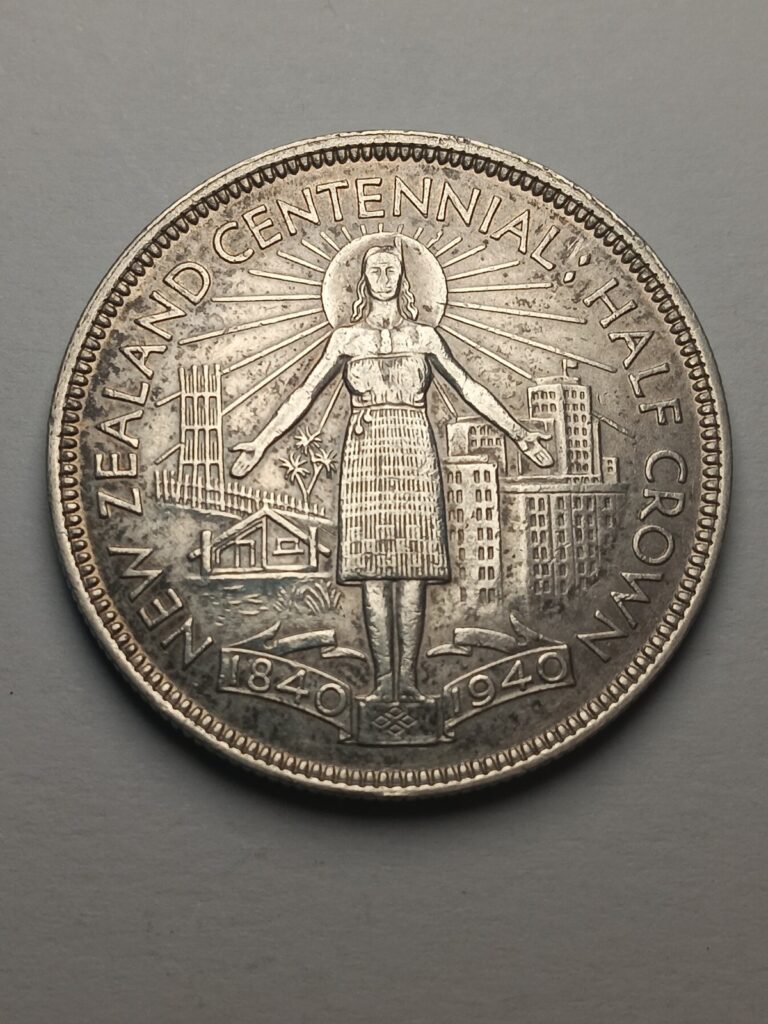 Read more about the article 1940 New Zealand Centennial George VI Silver Half Crown