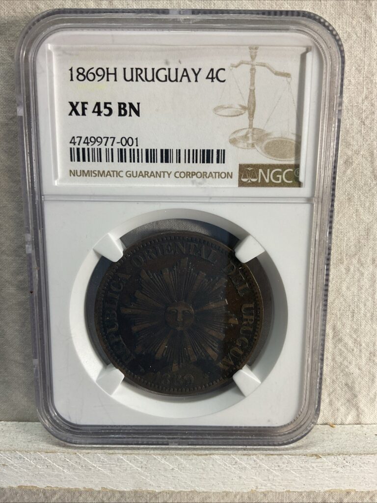 Read more about the article Uruguay 1869 4 centesimos sunburst Graded XF 45 BN