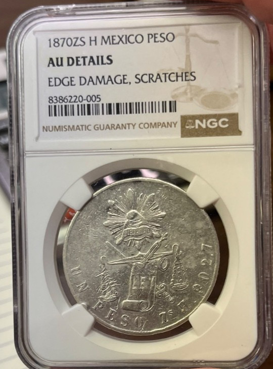 Read more about the article Mexico silver peso 1870 Zs H about uncirculated NGC AU Details