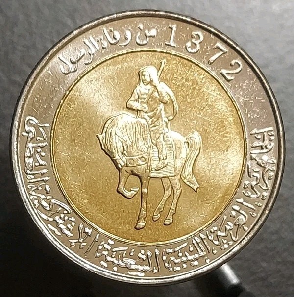 Read more about the article 2004 LIBYA 1/2 DINAR UNC BI-METALLIC COIN AH-1372 KM 27 ARMORED EQUESTRIAN HORSE