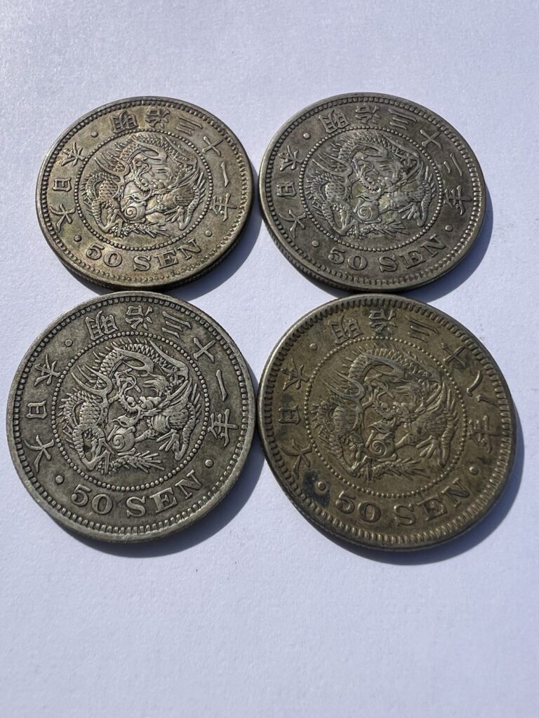 Read more about the article Lot of (4) Japan 50 Sen Silver Coins – (3) 1898 and (1) 1905 – Meiji Yr 31 and 38