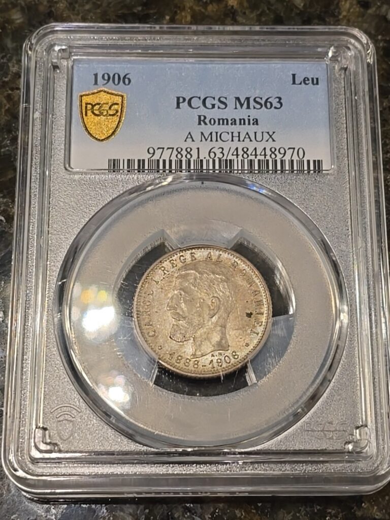 Read more about the article Romania 1906 1 Leu 40th Anniversary of Reign Carol I PCGS MS63 A MICHAUX Toned