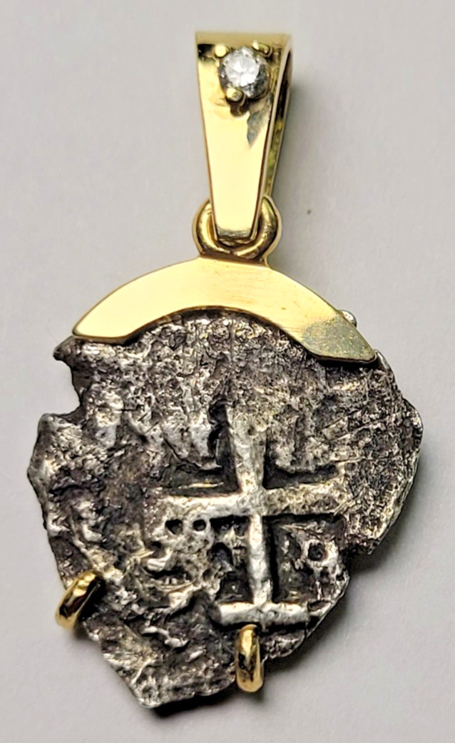 Read more about the article 1738 Spanish Colonial 1/2 reales Cob Coin Mounted in 14k GOLD with DIAMOND