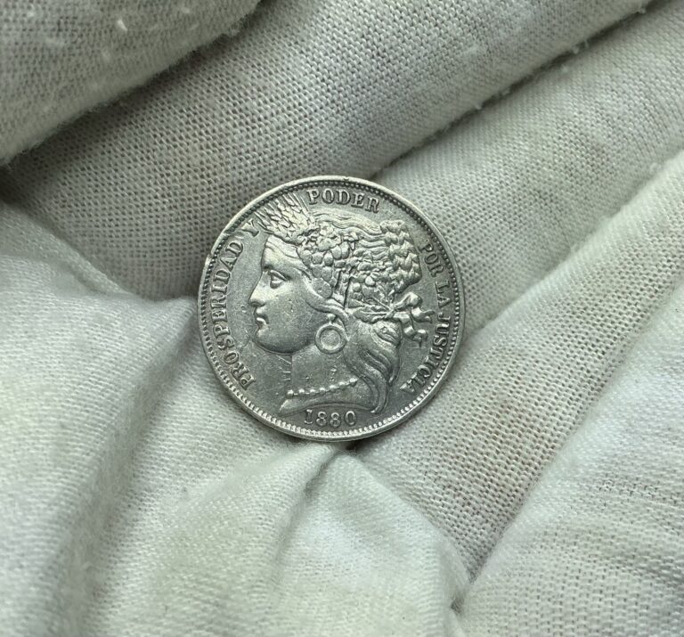 Read more about the article 1880 B Peru One Peseta Silver Coin With Dot U44