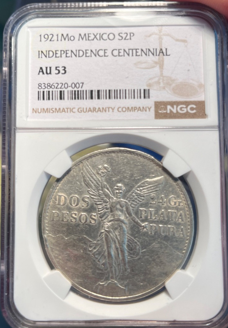 Read more about the article 1921 Mo Mexico Silver 2 Pesos S2P NGC AU53 Independence Centennial.