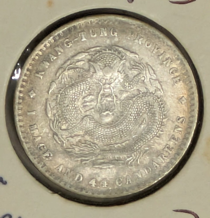 Read more about the article 1890 China Kwang Tung Province 1 Mace and 4.4 Candareens (20 Fen) Silver Coin.