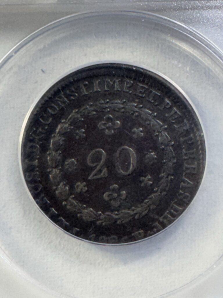 Read more about the article 1826-R Brazil 20 Reis Bronze Coin Struck 10% Off Center Graded VF 30 by ANACS