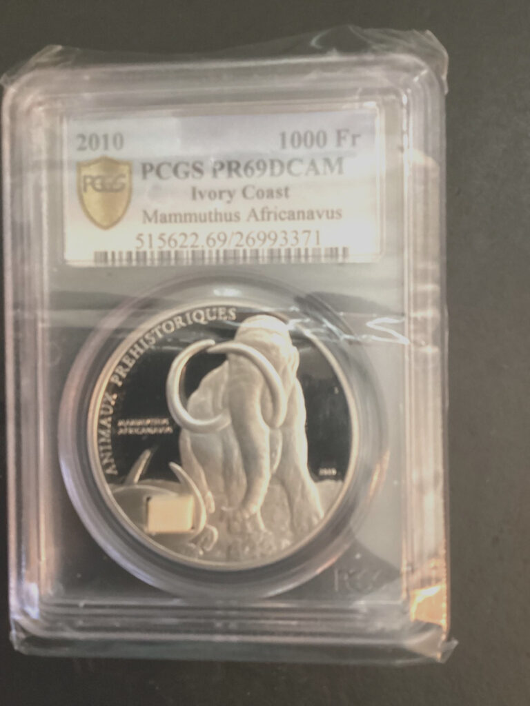 Read more about the article 2010 Ivory Coast 1000 Fr Prehistoric Mammoth PF69 PCGS .925 silver/Ivory Tusk!