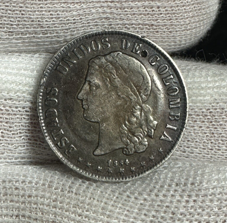Read more about the article 1884 COLOMBIA 20 CENTAVOS SMALL PUNCH KM-178.3 – B3830