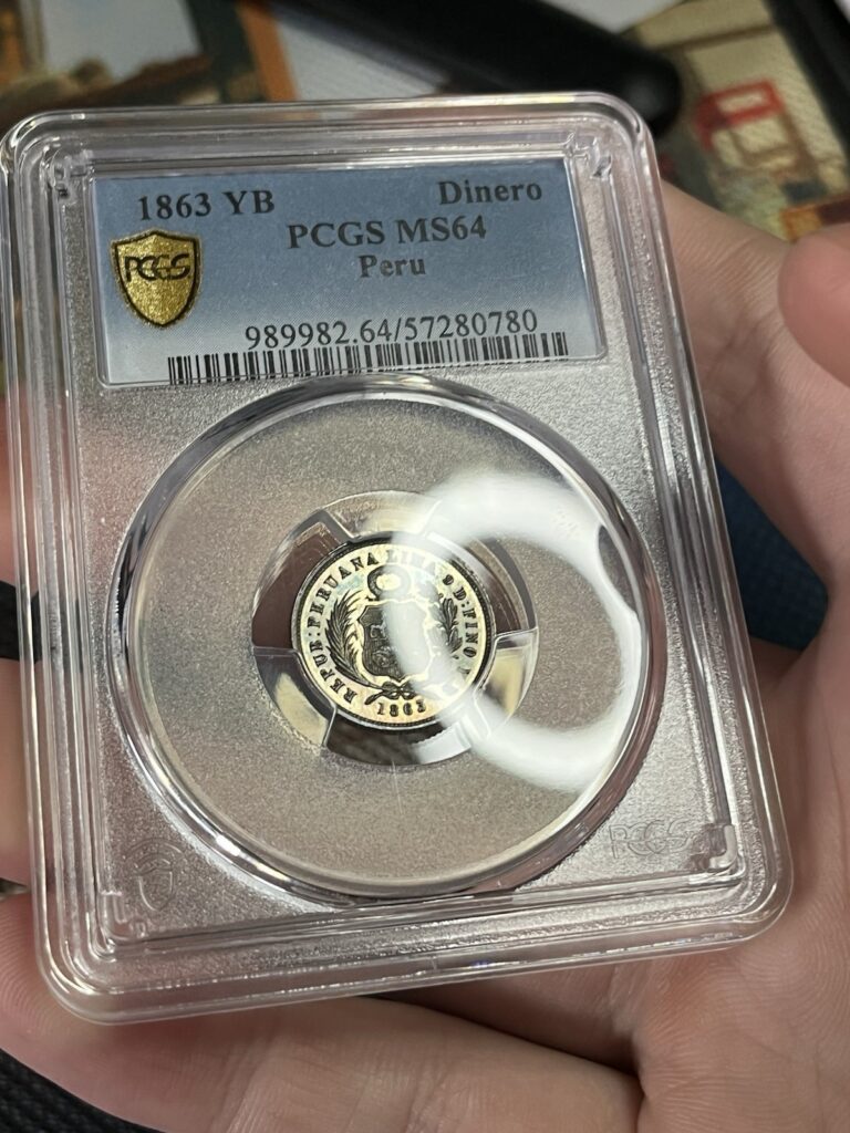 Read more about the article 1863 Peru Silver Dinero PCGS MS64 – Reflective And Toned!