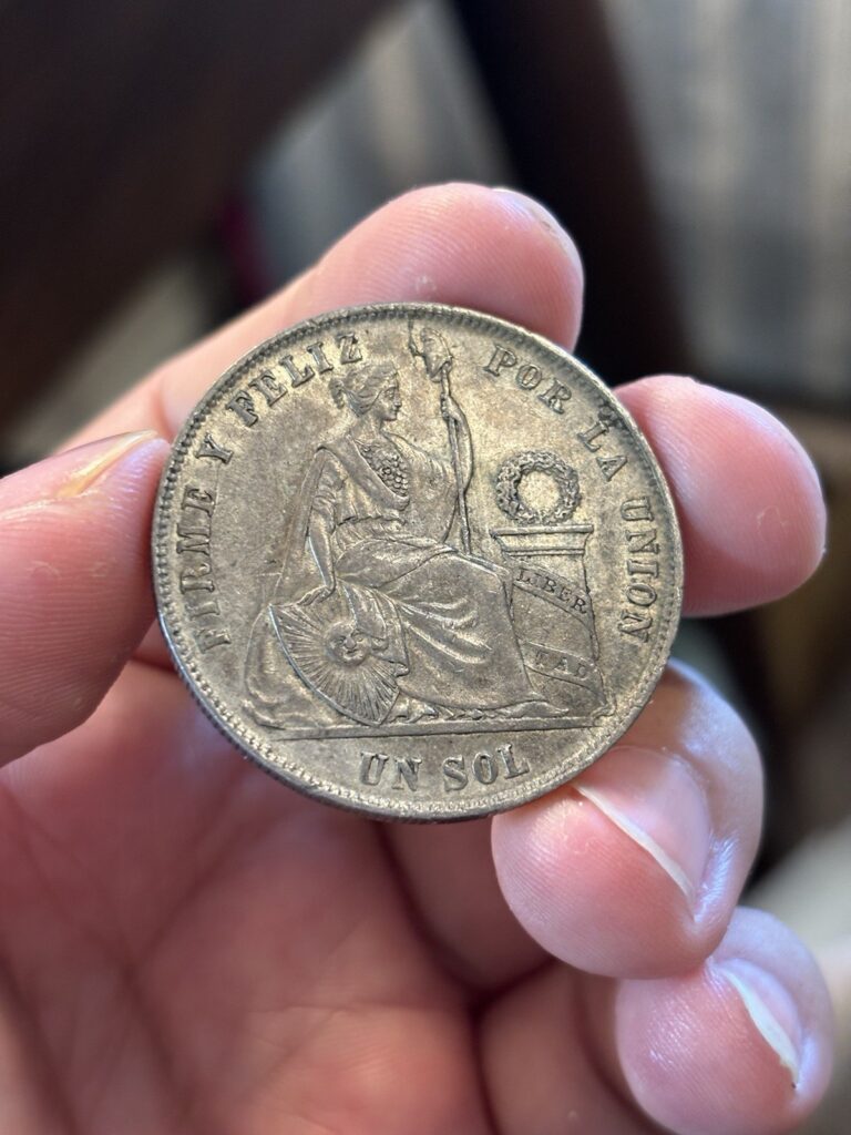 Read more about the article 1869 YB Peru Un Sol Silver Coin Toned